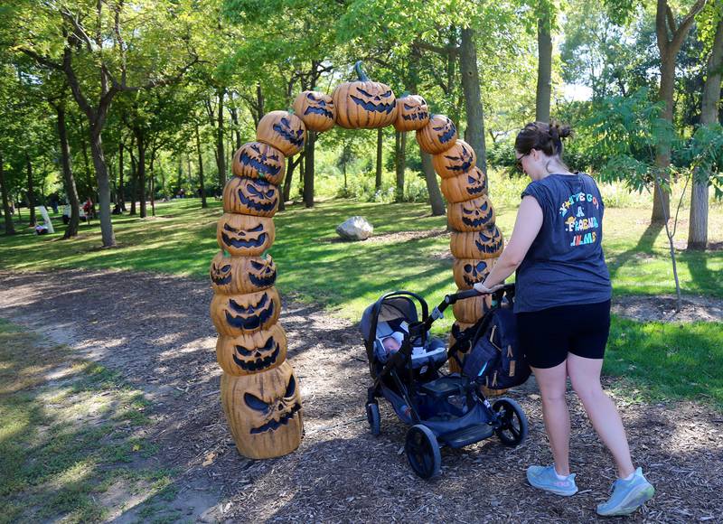 Sarah Maurella takes 1-month-old son Emmett for a walk in the Scarecrow Walk at Yorktoberfest in Yorkville on Saturday, Sep. 27, 2025.