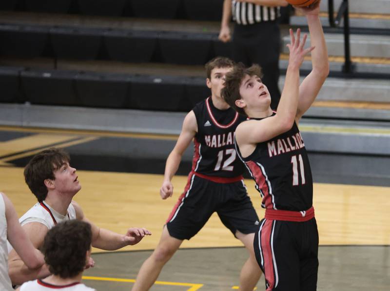 Henry-Senachwine's Landon Harbison runs in the lane to score on a layup against Woodland during the Tri-County Conference Tournament on Monday, Jan. 26, 2026 at Putnam County High School