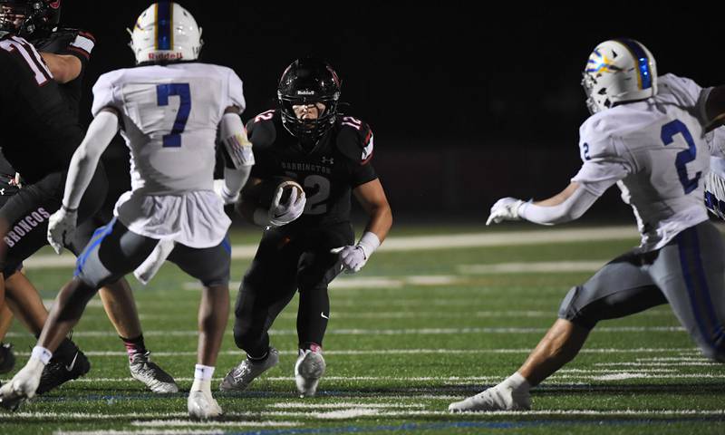 Barrington’s Dillon Fitpatrick looks for a hole against Warren at Barrington High School Friday, August 25, 2023.