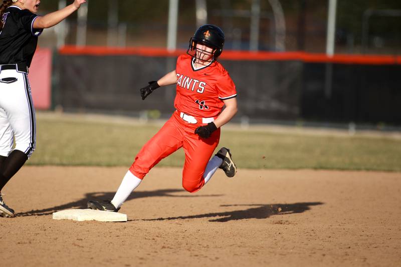 St. Charles East's Taylor Grendzinski rounds second base during a game against Downers Grove North on Friday, March 28, 2025 in St. Charles.
