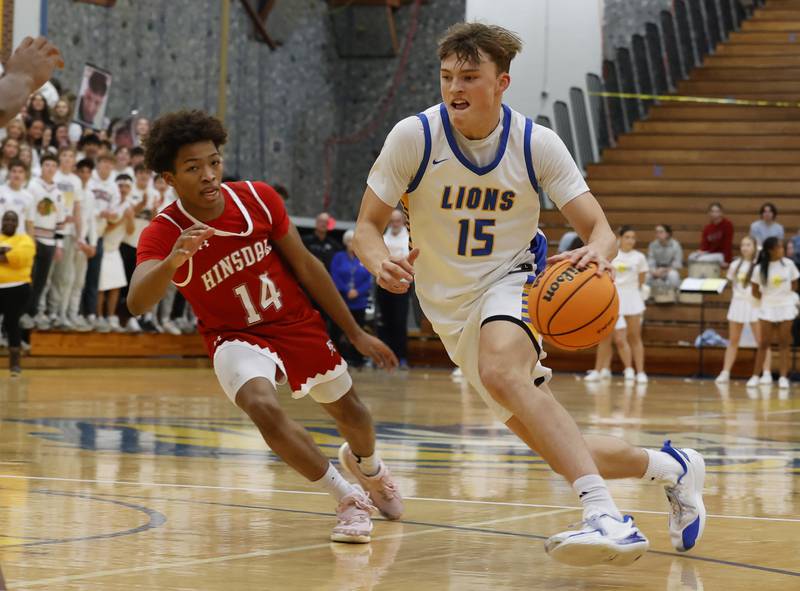 Lyons Township's Timmy Sloan (15) drives to the basket during a varsity basketball game between Hinsdale Central and Lyons Township high schools on Friday, Dec. 12, 2025 in La Grange.
