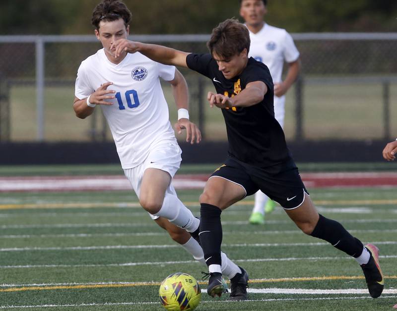 Richmond-Burton’s Nick Kyes controls the ball in front of Woodstock's Ivan Shoulders during a Kishwaukee River Conference soccer match on Wednesday, Sept. 10, 2025, at Richmond-Burton High School, in Richmond.
