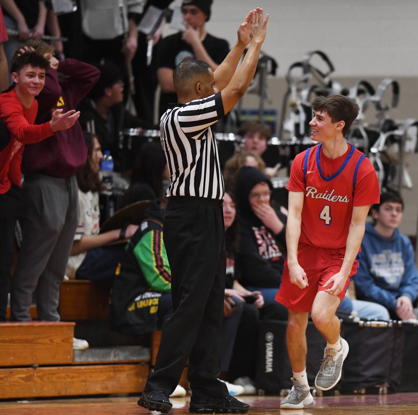 Glenbard South's PJ Lehr celebrates after hitting a three pointer during Friday’s game at Glenbard East.