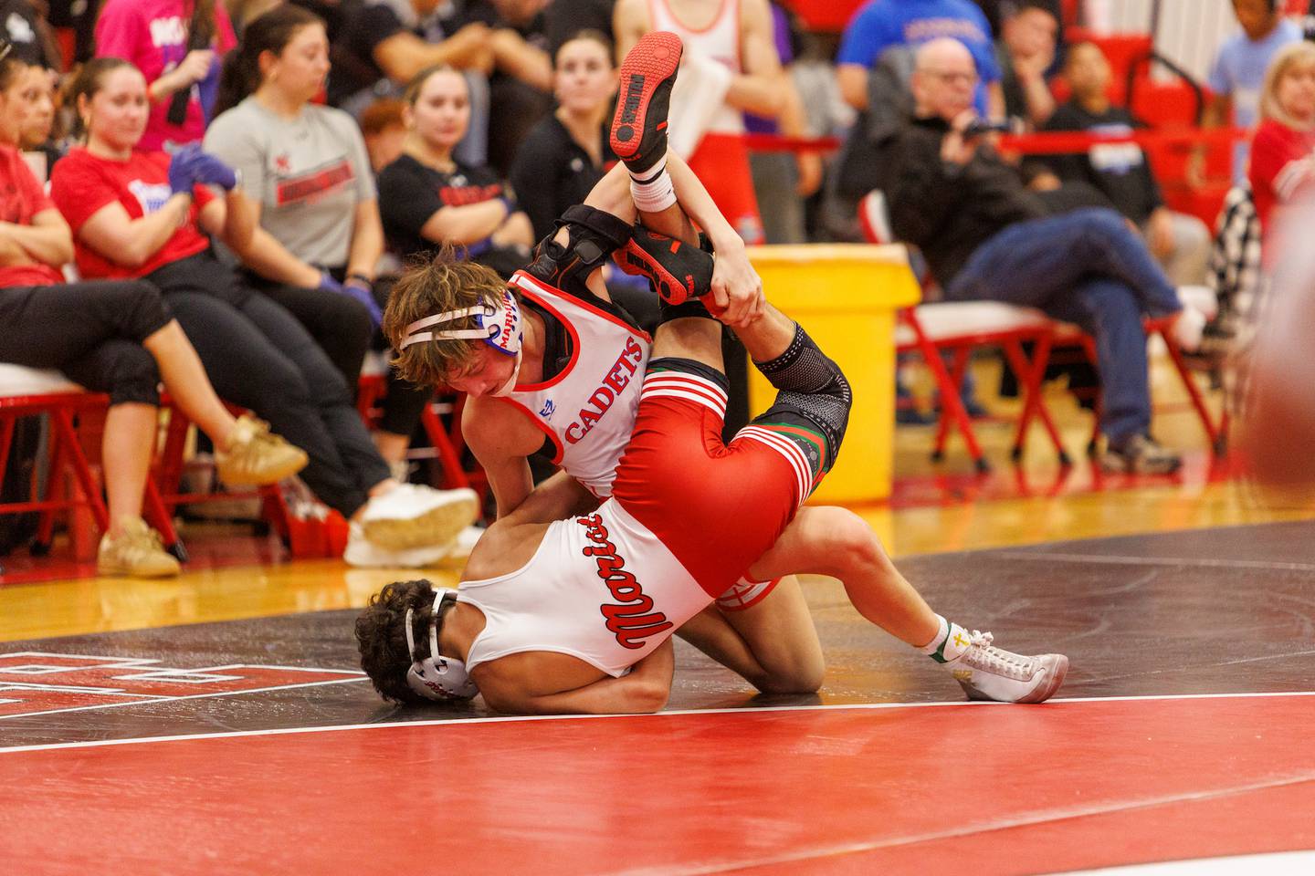 Marmion Academy's Colton Wyller competes in the 106 lb match  with Marist Elio Gil  at the Hinsdale Central Class 3A Sectional on Saturday, Feb.14,2026 in Hinsdale.