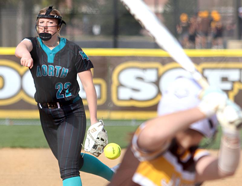 Woodstock North’s Casey Vermett deals in varsity softball at Algonquin Friday night.