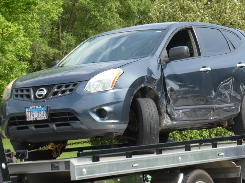 A vehicle being towed from the scene of a three-vehicle accident on Thursday, May 19, 2022, which included a school bus. Nobody was hurt during the accident, police said.