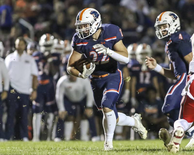 Oswego's Graham Schwab (22) runs the ball during football game between Bolingbrook at Oswego Friday, Sept 12, 2025  in Oswego.