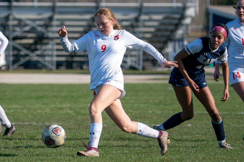 Oswego’s Lauren Widmer (9) plays the ball against Oswego East during a soccer match at Oswego East High School on Thursday, Apr 6, 2023.
