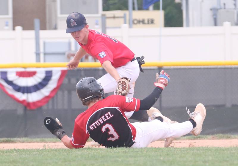 Burbank's Danny Coyle tags out Spring Valleys's Jonathan Stunkel during the Central Regional Senior Baseball Regional tournament at J.A. Happ Field in Washington Park in Peru.