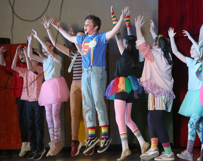 Jack McCray as Jesus act out a scene while performing in "Godspell  Jr." on Friday, March 27, 2026 at The Academy of Saint Carlo Acutis school in Oglesby.