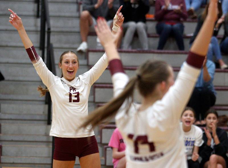 Prairie Ridge’s Abigail Smith  celebrates a point over Hampshire during varsity volleyball on Thursday, Oct. 3, 2024, at Prairie Ridge High School in Crystal Lake.