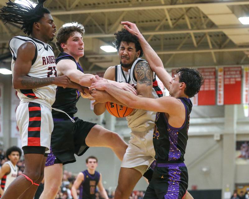 Bolingbrook's Joshua Pettigrew (22) grabs a rebound during their Class 4A Bolingbrook Sectional semifinal basketball game between Downers Grove North at Bolingbook. March 4, 2025 in Lisle.