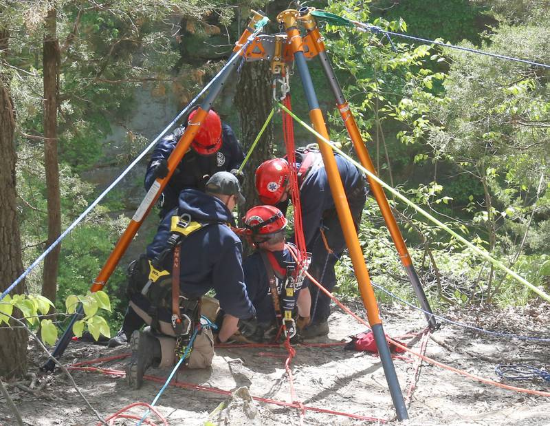 Firefighters conduct rope rescue training using a TerrAdaptor on Saturday, May 2, 2026 in Wildcat Canyon at Starved Rock State Park. The tripod device is a system designed for rescues.