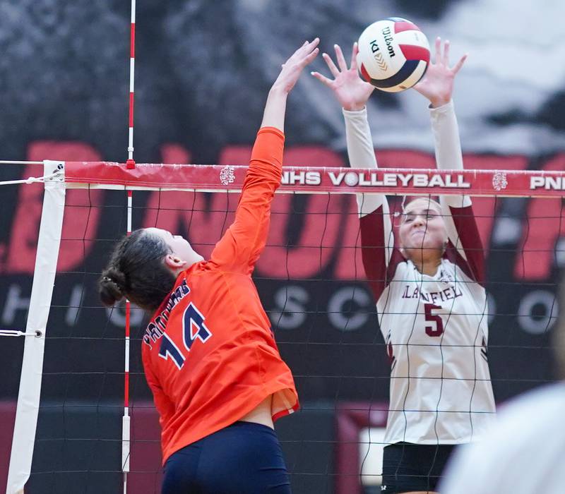Plainfield North's Elizabeth Fitzgerald (5) defends the net against Oswego’s Mia Jurkovic (14) during the class 4A Plainfield North regional volleyball final at Plainfield North High School on Thursday, Oct. 26, 2023.