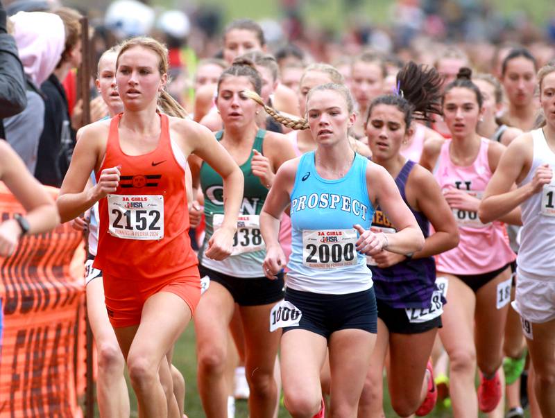 Wheaton Warrenville South's Nicole Poglitsch (left) competes in the Class 3A State Cross Country Championships on Saturday, Nov. 9, 2024 at Detweiller Park in Peoria.