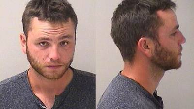 Driver charged after almost rear-ending Batavia police car