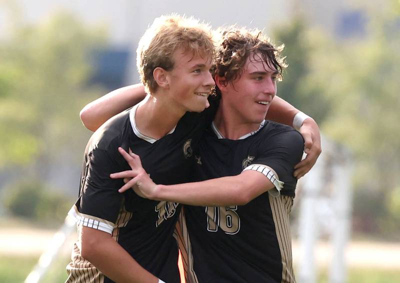 Sycamore's Gavin Crouch (left) celebrates scoring a goal with teammate Maddux McLaughlin during their game against Kaneland Monday, Oct. 6, 2025, at Sycamore High School.