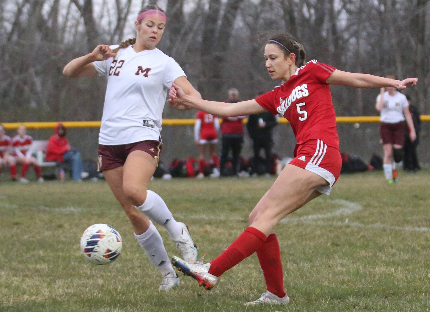 Streator's Alyssa Arambula kicks the ball past Morris's Cassie Bernal on Monday, March 25, 2024 at the James Street Recreation Area in Streator.