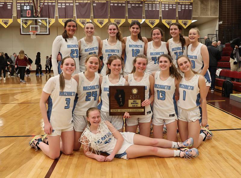 Nazareth celebrates their win after the girls 3A varsity super-sectional game between Nazareth Academy and Fenwick High School in River Forest on Monday, Feb. 27, 2023.
