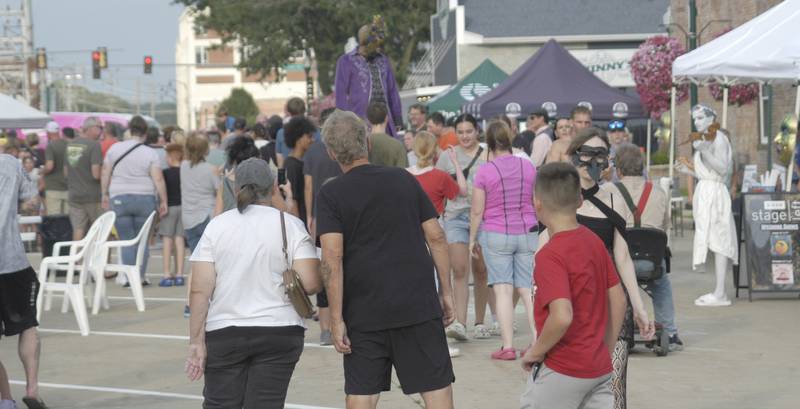 The crowd fills the Dixon riverfront during Venetian Night on Saturday, Aug. 9, 2025. Venetian Night in Dixon featured magicians, street performers, face painting, a spaghetti eating contest, mini boat races,  a drone light show and more.