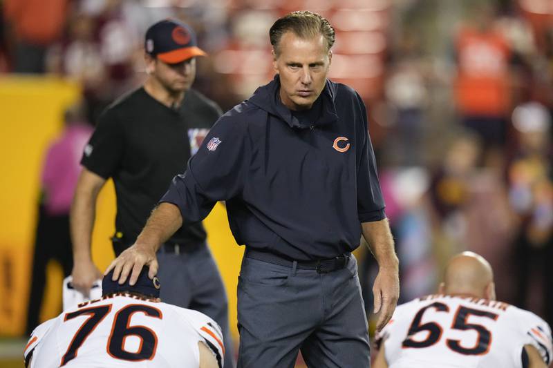 Chicago Bears head coach Matt Eberflus greets offensive tackle Teven Jenkins before the start of an NFL game against the Washington Commanders, Thursday, Oct. 5, 2023, in Landover, Md.