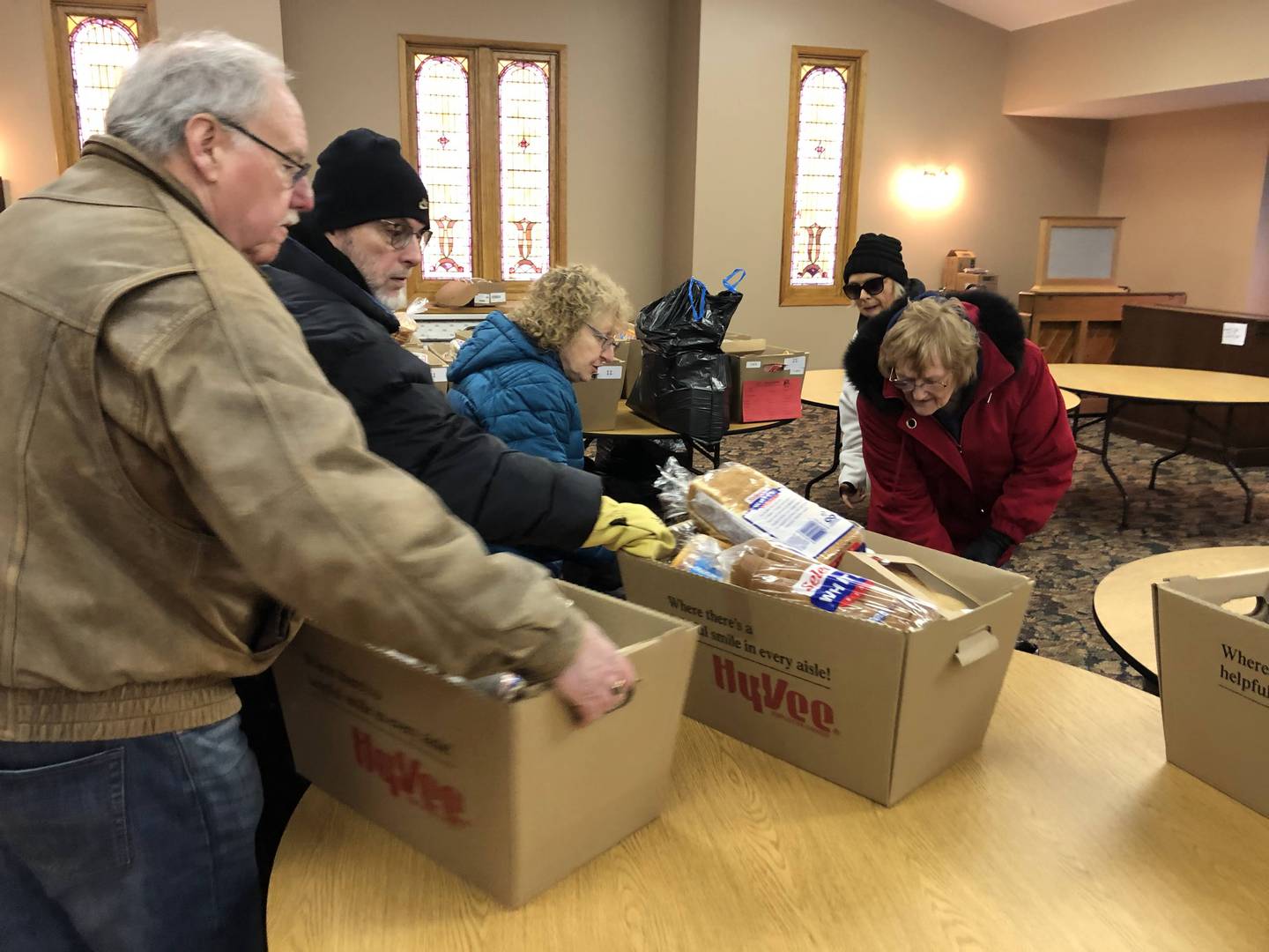Volunteers help the Putnam County food pantry distribute Christmas baskets to families at the United Church of Christ in Granville on Saturday, Dec 17, 2022.