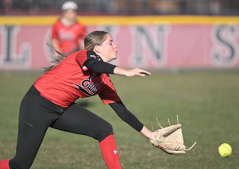 Glenbard East leftfielder Raya Schwebl can’t reach a sinking drive from South Elgin’s Madison Hunt in a softball game in South Elgin on Tuesday, April 9, 2024.