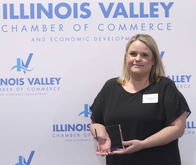 Angela Partridge poses with her Cornerstone award during the Illinois Valley Chamber of Champions of Change Awards Night on Wednesday, May 6, 2026 at the Westclox Event Center in Peru.