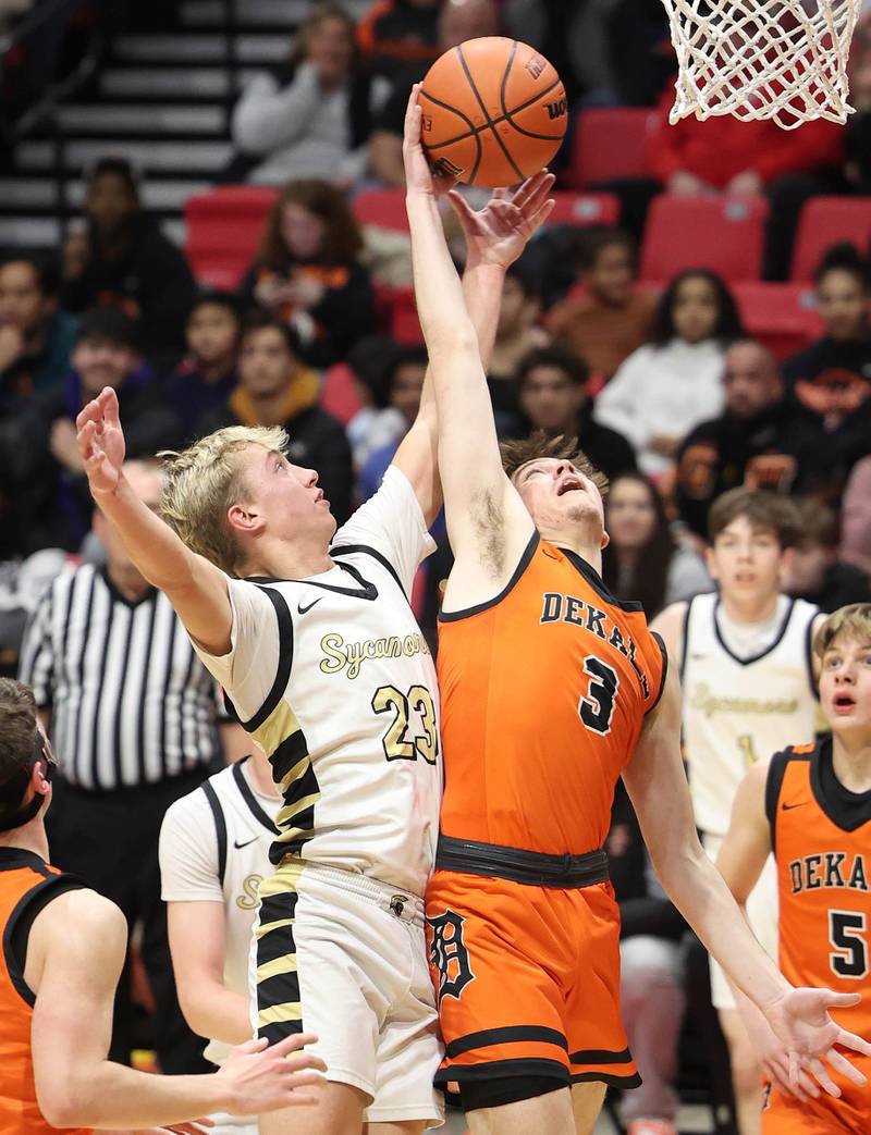 Sycamore's Carter York and DeKalb's Cooper Phelps go after a rebound during the First National Challenge Friday, Jan. 27, 2023, at The Convocation Center on the campus of Northern Illinois University in DeKalb.