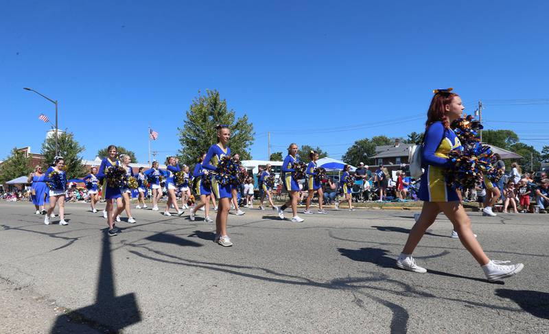 Logan Lions cheerleaders march in the 52nd annual Homestead Festival parade on Saturday, Sept. 9, 2023 in Princeton.