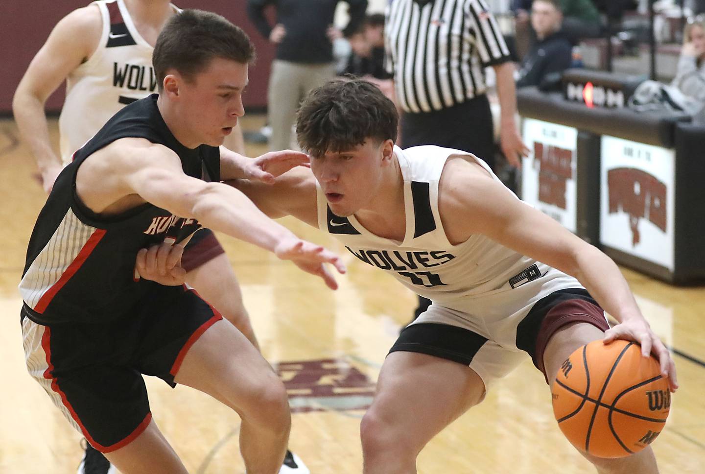 Prairie Ridge's Elijah Loeding (right) tries to drive the baseline against Huntley's Brady Hassels during a Fox Valley Conference boys basketball game on Wednesday, Jan. 21, 2026, at Prairie Ridge High School in Crystal Lake.