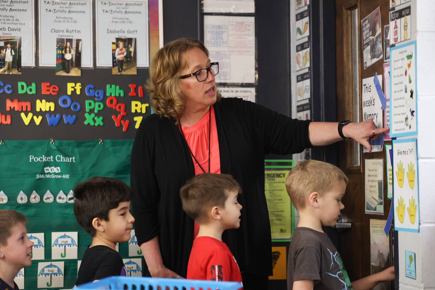 Kindergarten teacher Angela Furgal recites a Bible verse with her students ahead of recess at Grace Christian Academy.