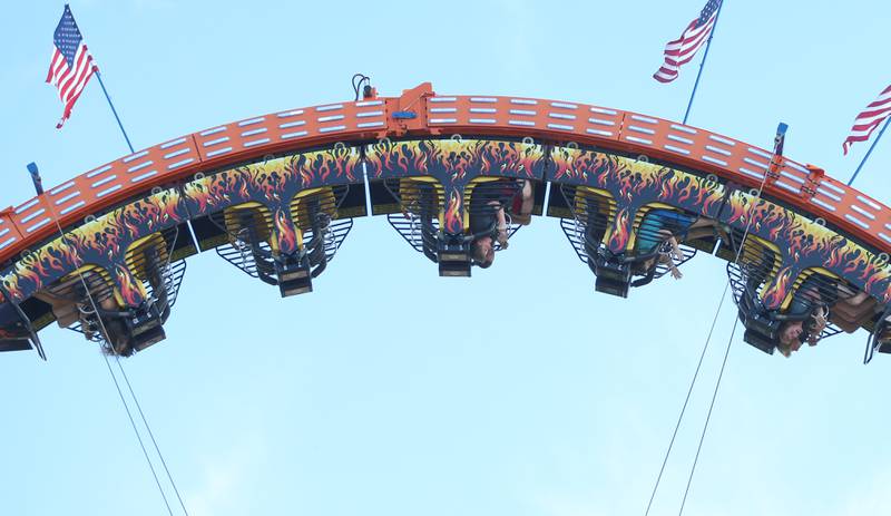 Kids ride the Ring of Fire carnival ride during the 170th annual Bureau County Fair on Saturday, Aug. 23, 2025 in Princeton.