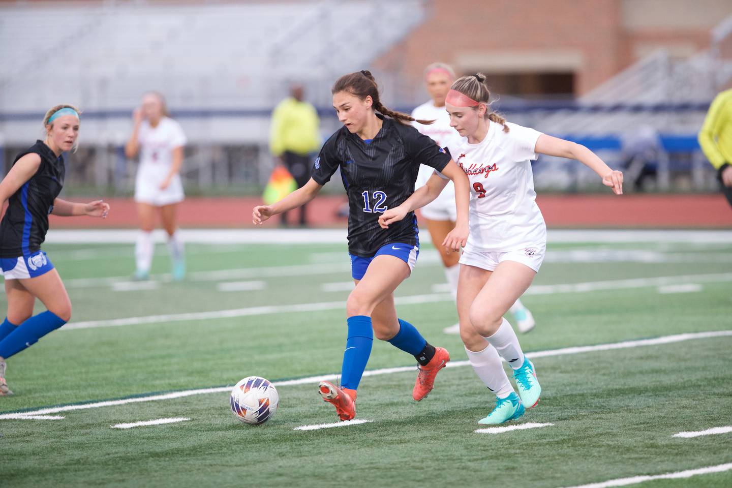 St. Charles North's Kyra Treanor battles for the ball against Batavia's Alexa Schorr  on Thursday April 11, 2024 in St. Charles.