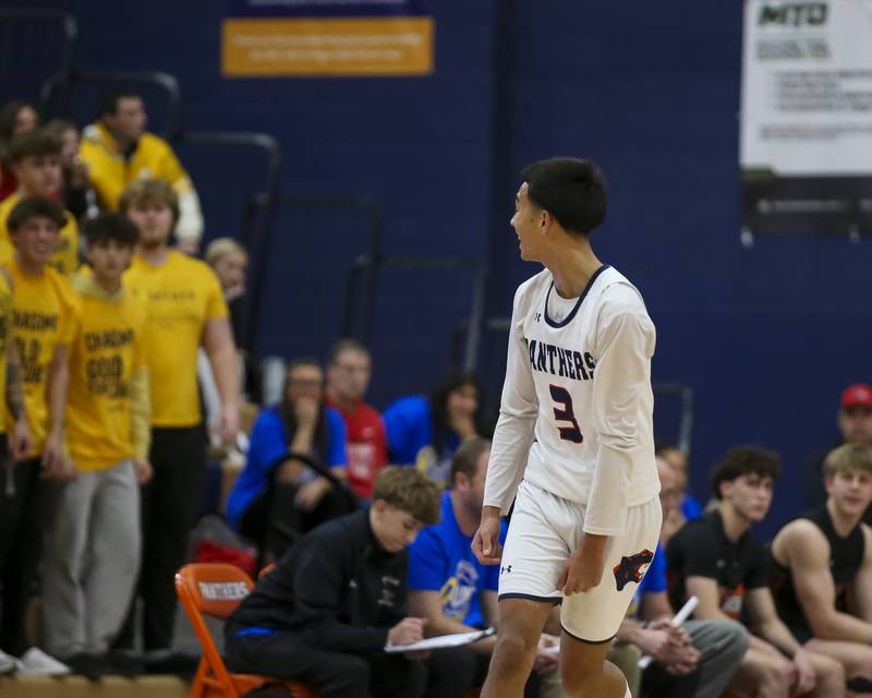 Oswego's Ethan Vahl (3) stares down the Yorkville student section after hitting a three pointer during their basketball game between Yorkville at Oswego, Feb 7, 2026 in Oswego.