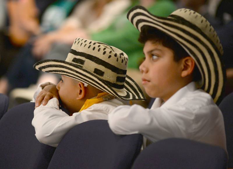 District 102 students (left) Sebastian Ramirez and Diago Gonzalez intently watch other student performances prior to theirs during the  Expo De Bellas Artes held at Park Junior High Friday April 21, 2023.