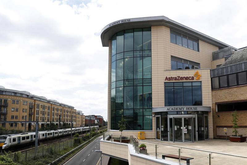 FILE - In this Saturday, July 18, 2020 file photo a general view of AstraZeneca offices and the corporate logo in Cambridge, England. AstraZeneca says late-stage trials of its COVID-19 vaccine were "highly effective'' in preventing disease. A vaccine developed by AstraZeneca and the University of Oxford prevented 70% of people from developing the coronavirus in late-stage trials, the team reported Monday Nov. 23, 2020.(AP Photo/Alastair Grant, File)