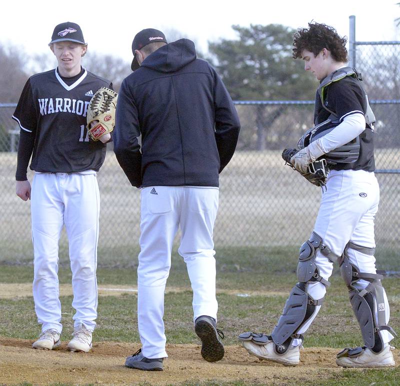 A meeting at the mound is called in the 1st inning after Starting Pitcher Connor Dodge gave up 6 runs against Roanoke Benson Tuesday at Woodland.