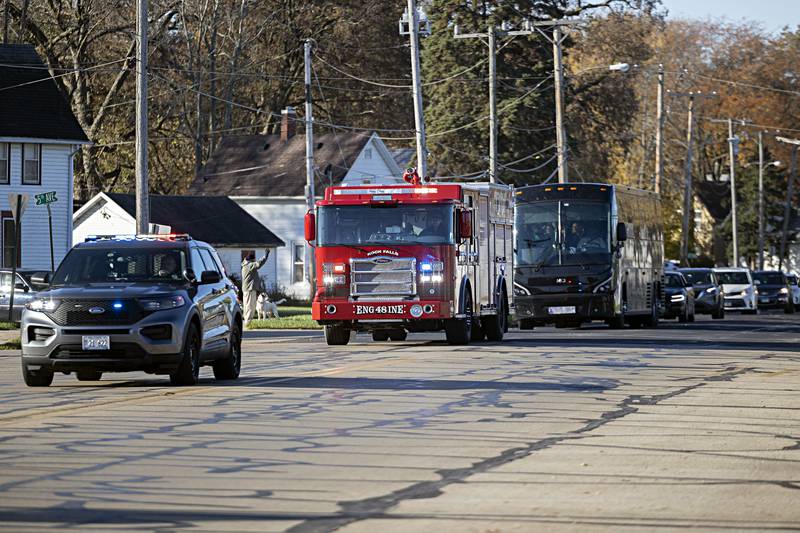 The Rock Falls volleyball team gets a police and fire escort as they head down to the state tournament Thursday, Nov. 9, 2023 in Normal.