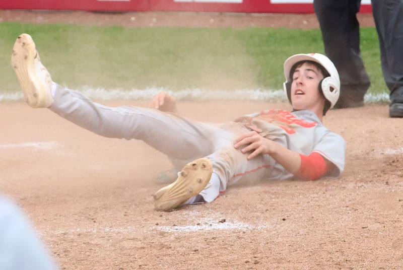 Ottawa's Colt Bryson slides in safely to home plate to score a run against L-P on Thursday, April 30, 2026 at Huby Sarver Field in the L-P Athletic Complex in La Salle.