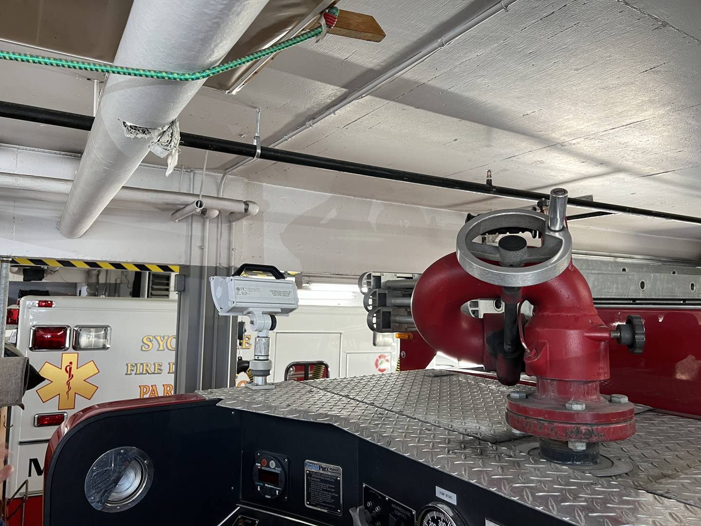 There are only a few inches of clearance between the top of fire engines docked at Sycamore Fire Station 1 and the pipes that run overhead. Picture taken June 9, 2023.