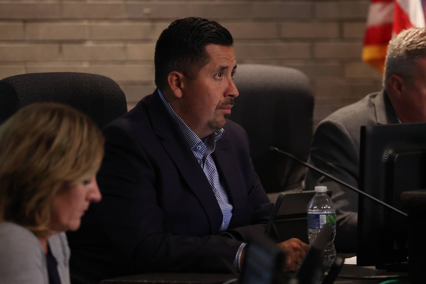 Council member Cesar Cardenas listens to a speaker at the Joliet City Council meeting on Tuesday, July 18th, 2023.