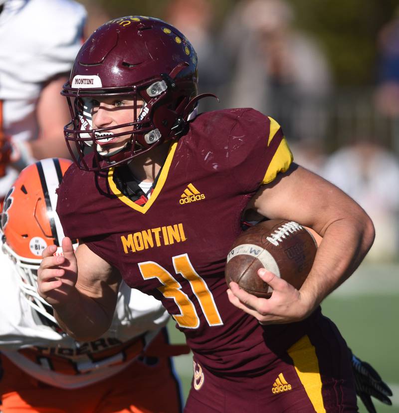 Joe Lewnard/jlewnard@dailyherald.com
Montini's Alex Marre carries the ball during the Class 3A semifinal game against Byron in Lombard Saturday.