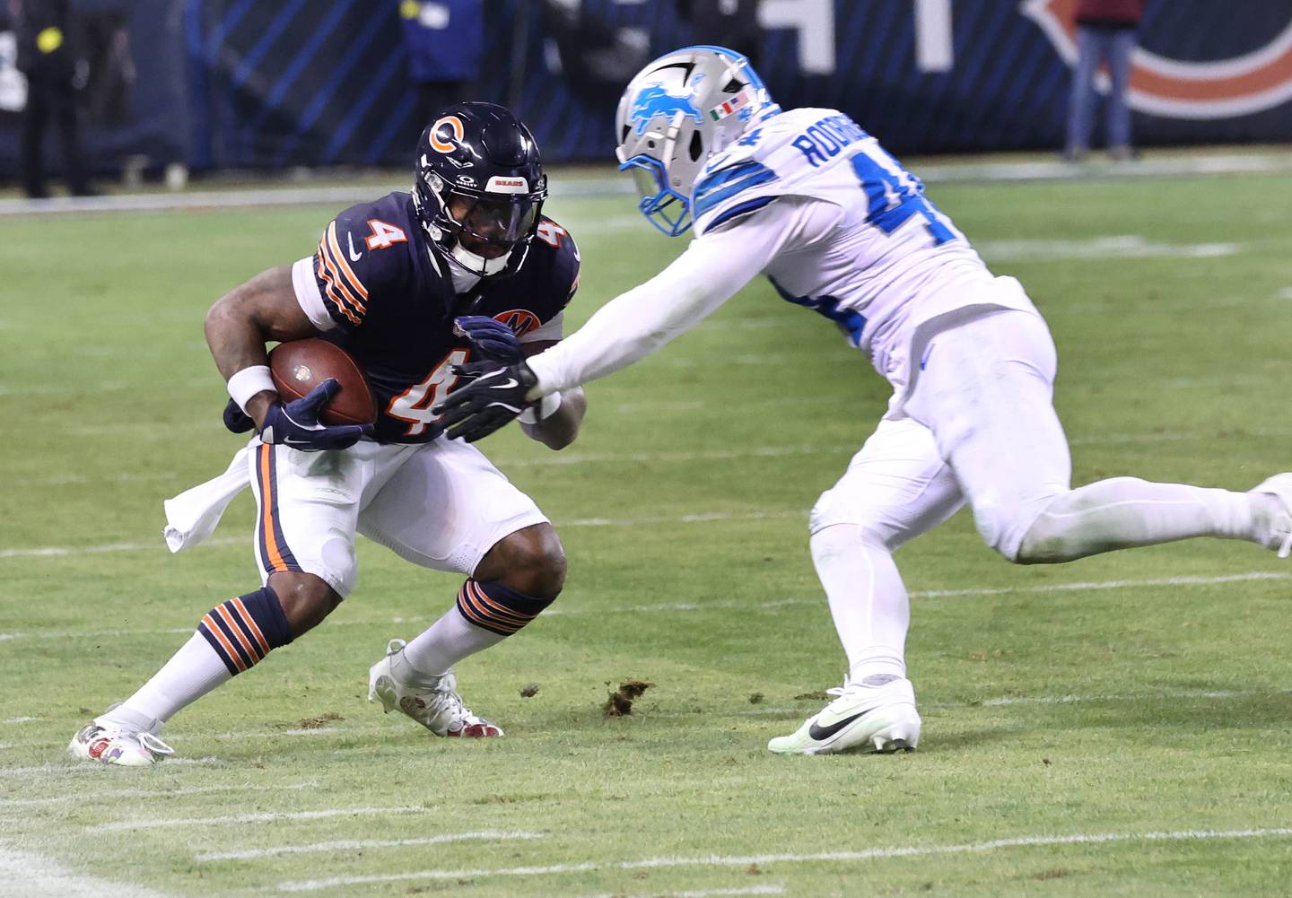 Chicago Bears running back D'Andre Swift tries to get by Detroit Lions linebacker Malcolm Rodriguez during their game Sunday, Jan. 4, 2026, at Soldier Field in Chicago.