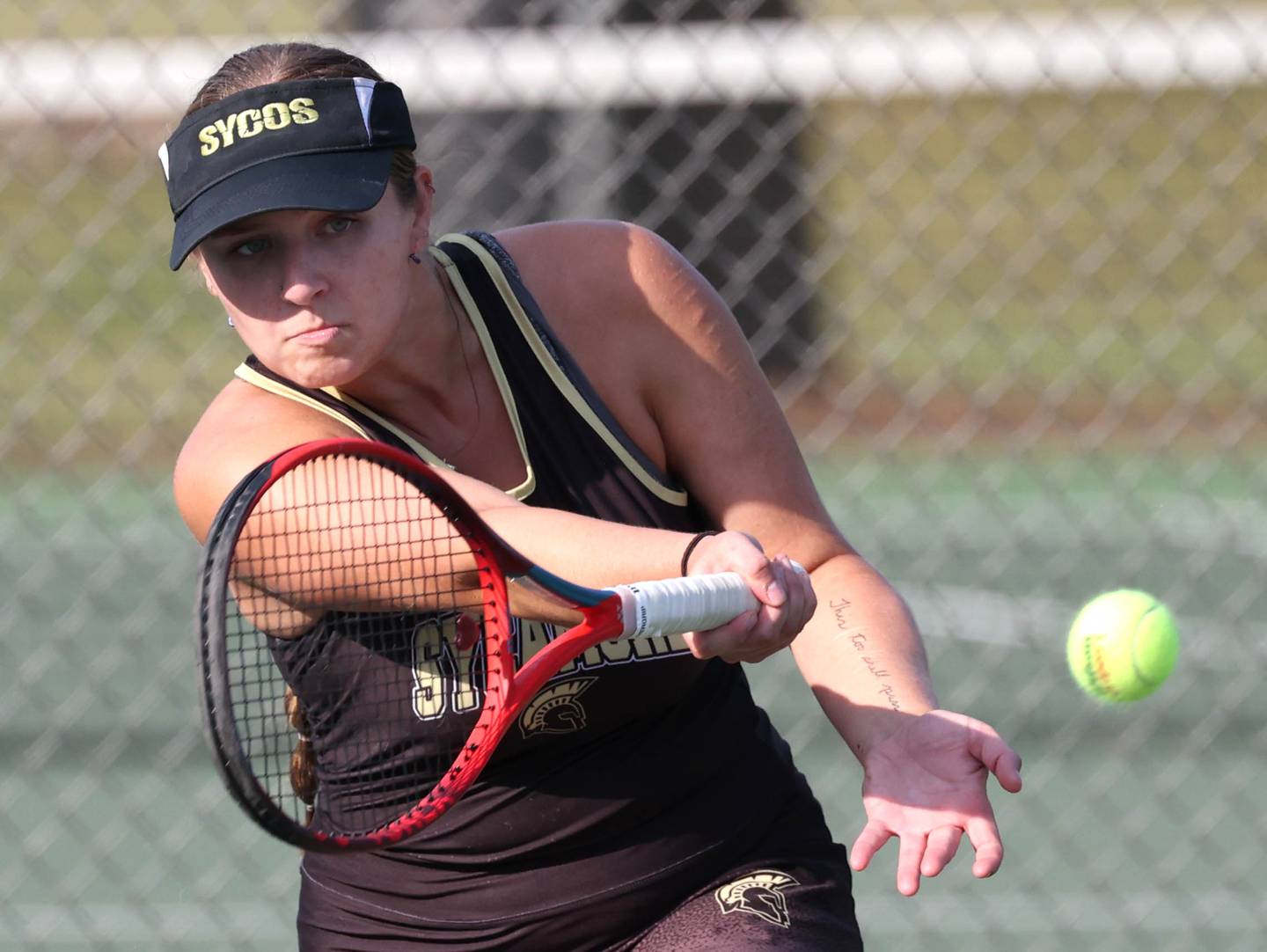 Sycamore’s Maggie Klein hits a shot during her doubles match against DeKalb Wednesday, Sept. 18, 2024, at Sycamore High School.