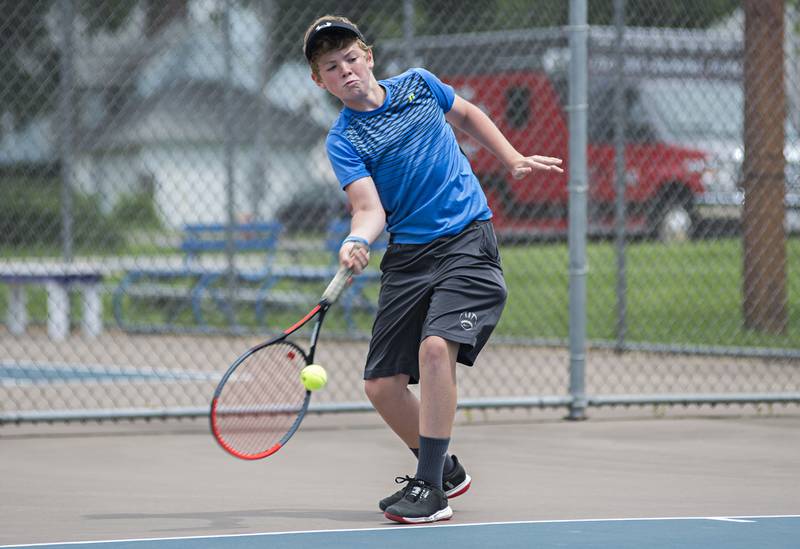 Joel Rhodes returns a shot while playing in the 15 and under boys single tournament during the Emma Hubbs tennis classic in Dixon.