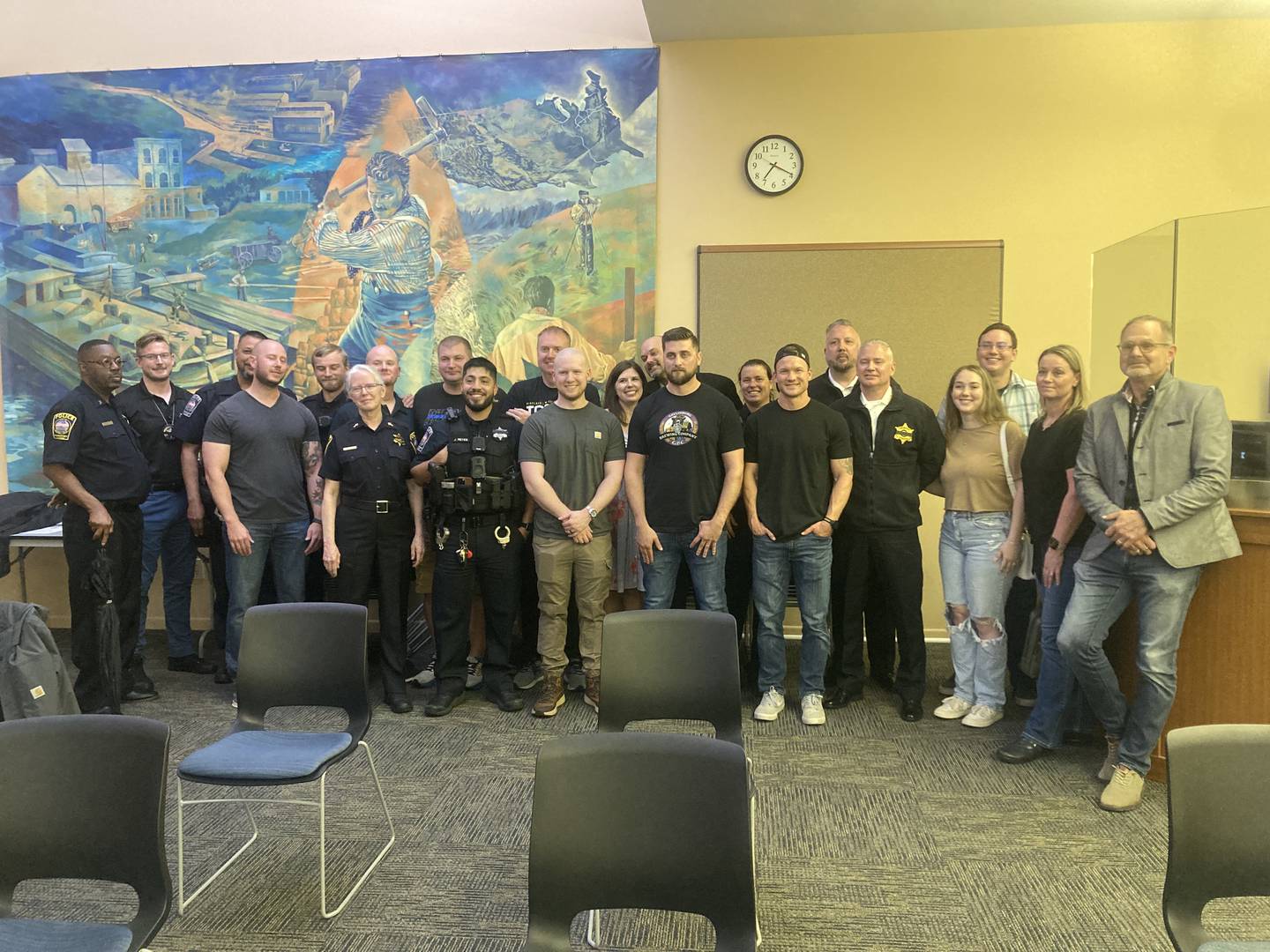Retiring Police Chief Rich Harang stands with his family, Mayor Steven Streit, and members of the the Lockport Police Department who came out to support him at the Wednesday, June 18, 2025 City Council meeting.