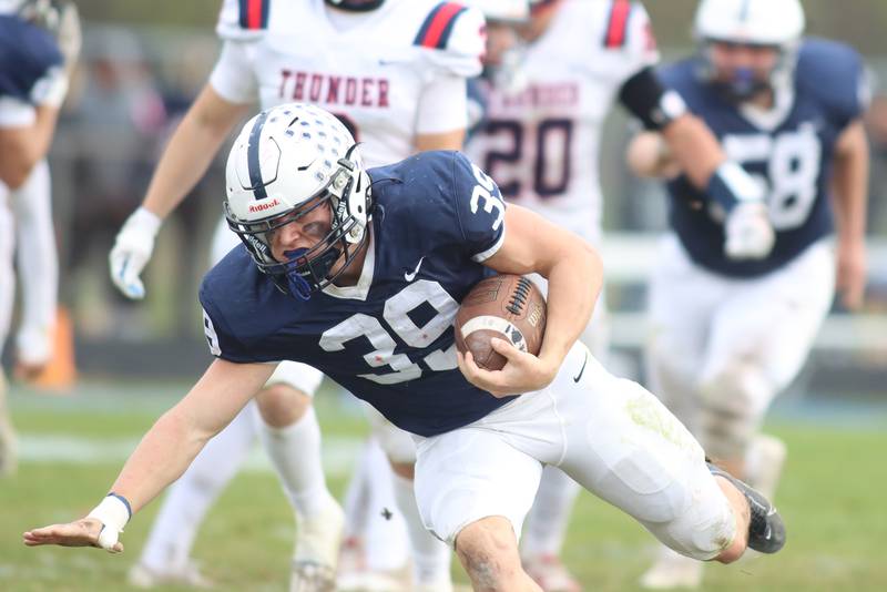Cary-Grove’s Holden Boone runs the ball against Belvidere North in IHSA Class 6A quarterfinal playoff football action on Saturday, Nov. 16, 2024, at Al Bohrer Field on the campus of Cary-Grove High School in Cary.