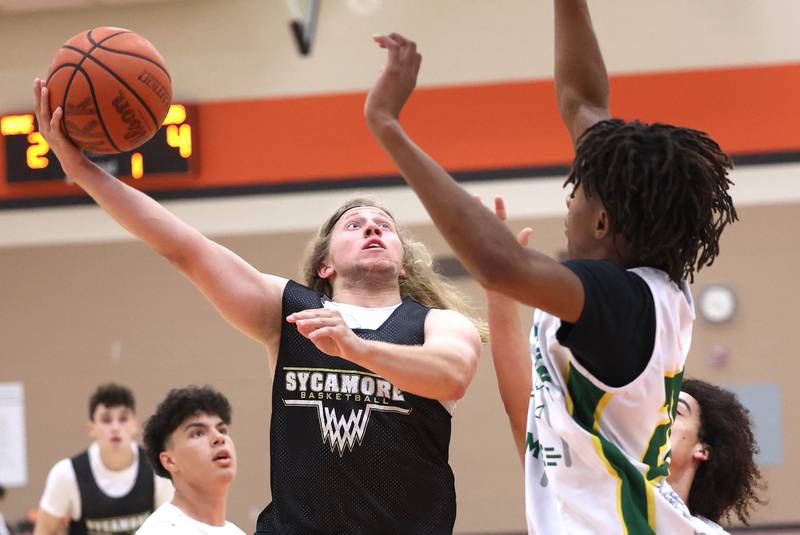 Sycamore’s Carter McCormick goes to the basket during their summer game against Boylan Tuesday, June 18, 2024, at DeKalb High School.