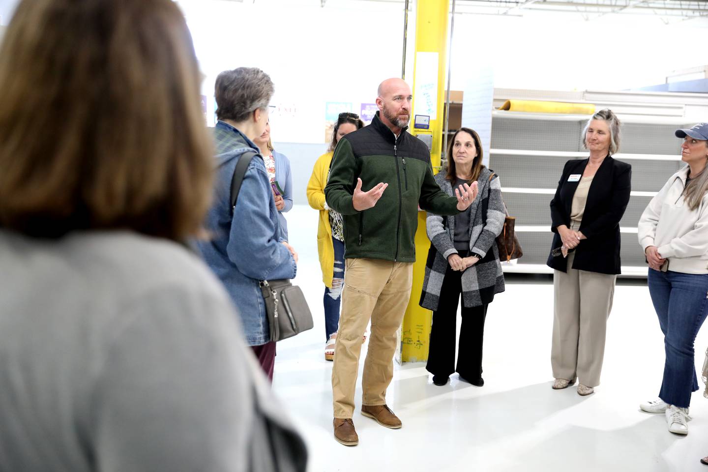 Kendall County Food Pantry Executive Director Alex Hurd gives a tour of the newly refurbished facility during an open house and ribbon-cutting ceremony on Wednesday, April 16, 2025 in Yorkville.